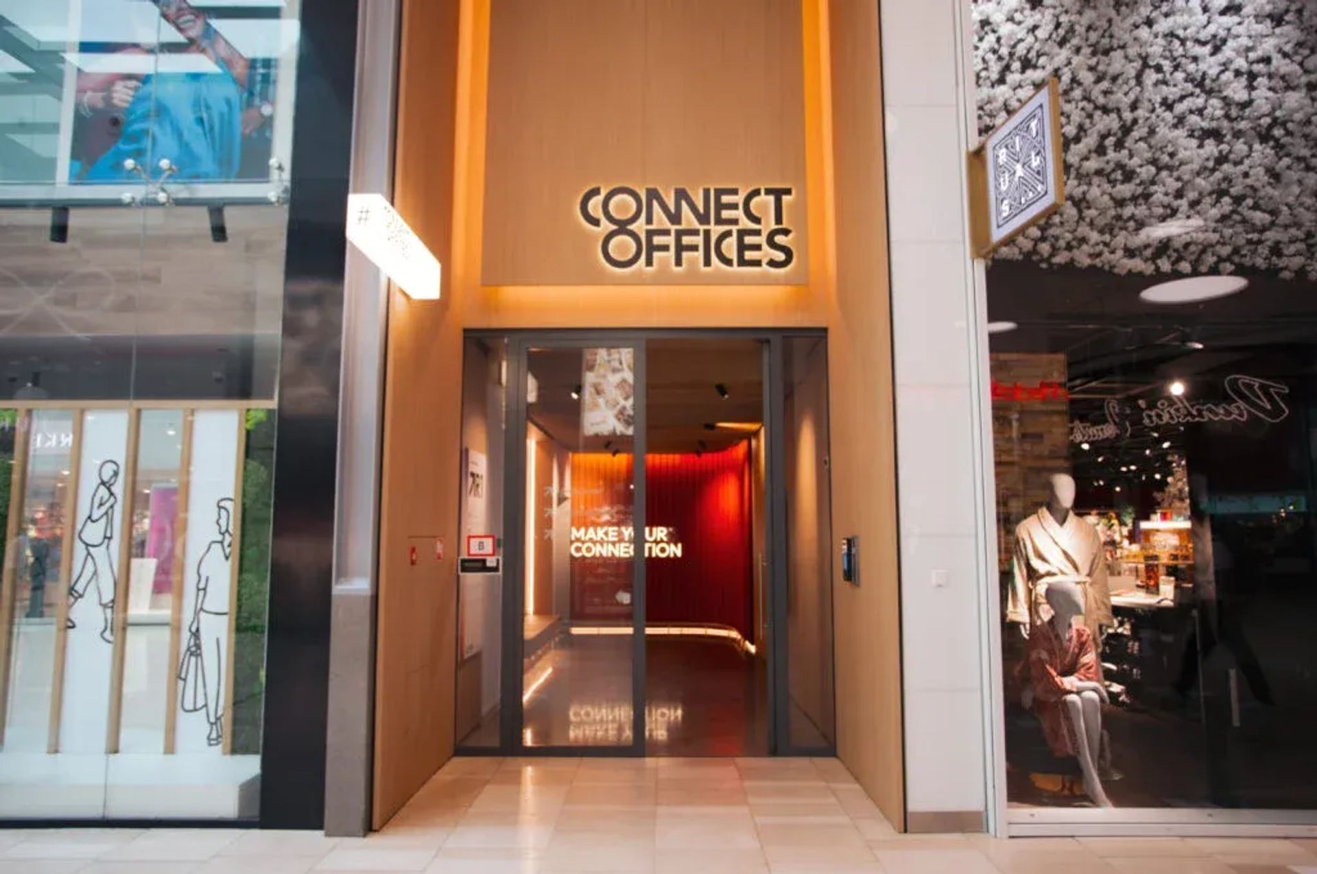 Modern office entrance with glass doors, a 